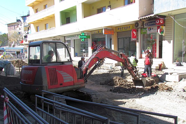 a backhoe at work on one of the street in Lezhe